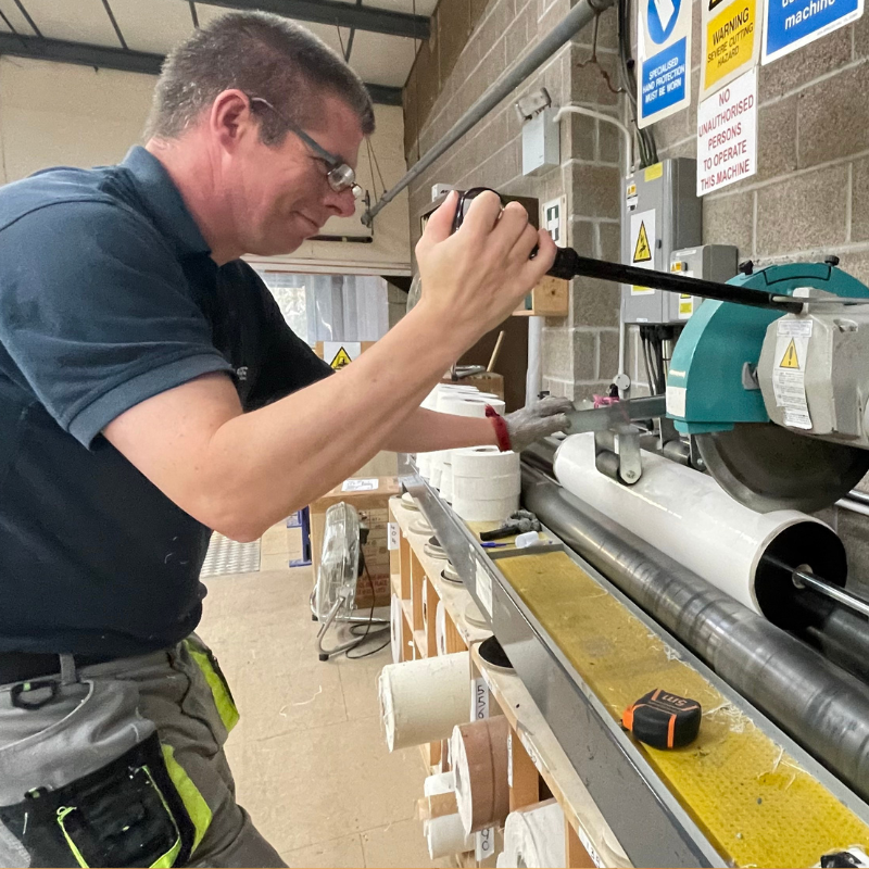 A man working in Pluss' Manufacturing in Plymouth