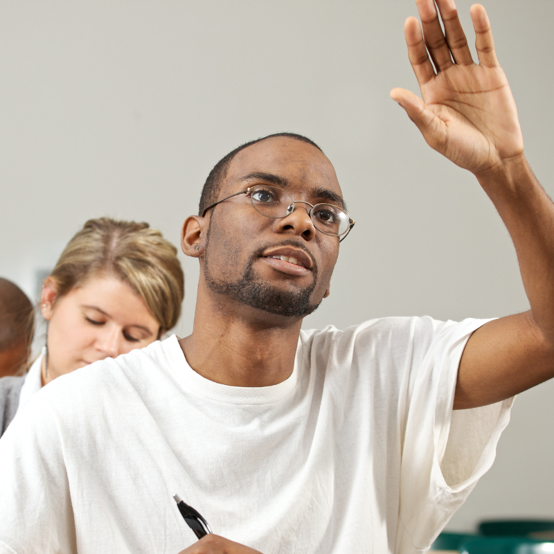 A man puts his hand up to ask a question