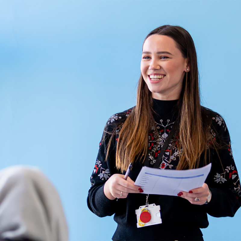 Woman holding papers for research