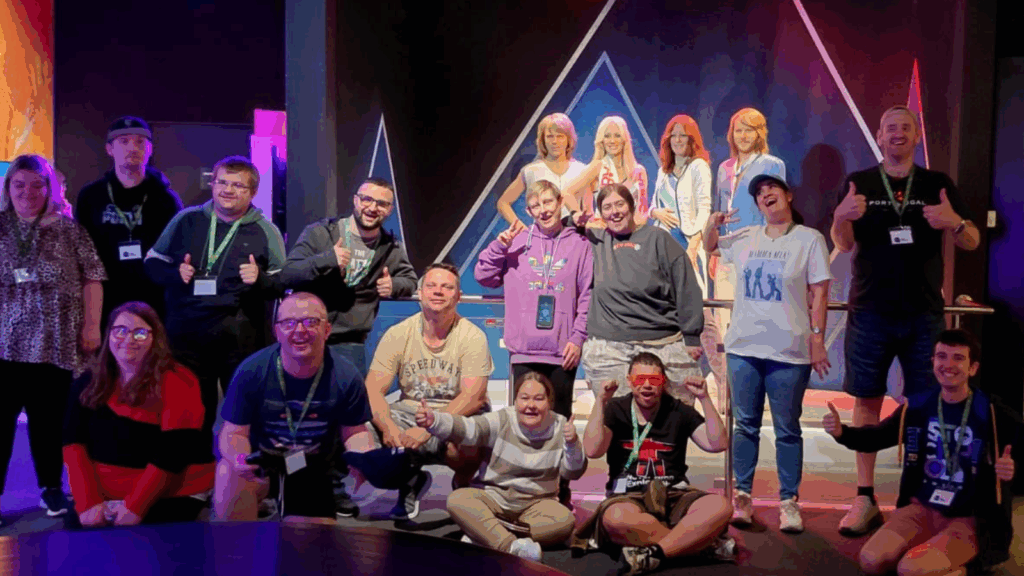 The Pluss team posing with Abba (or at least their holograms!)