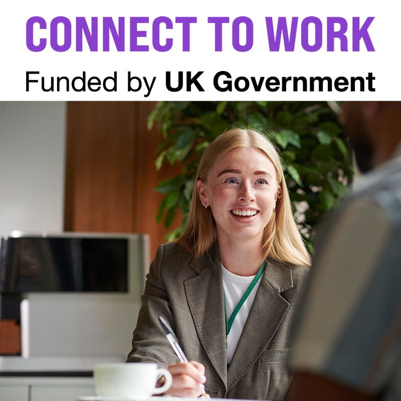 Smiling female work coach talking to a participant who is out of shot.