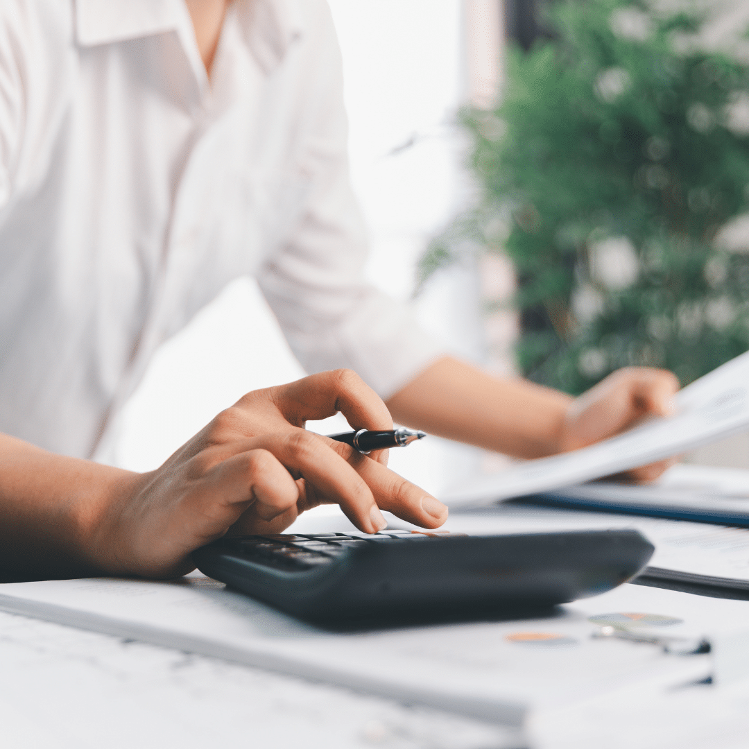 Close up of a person's hand using a calculator for a credit controller apprenticeship role.