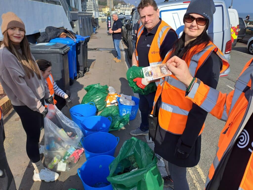 Volunteers from Seetec working together for a beach clean in Teignmouth, for the Great British Spring Clean campaign