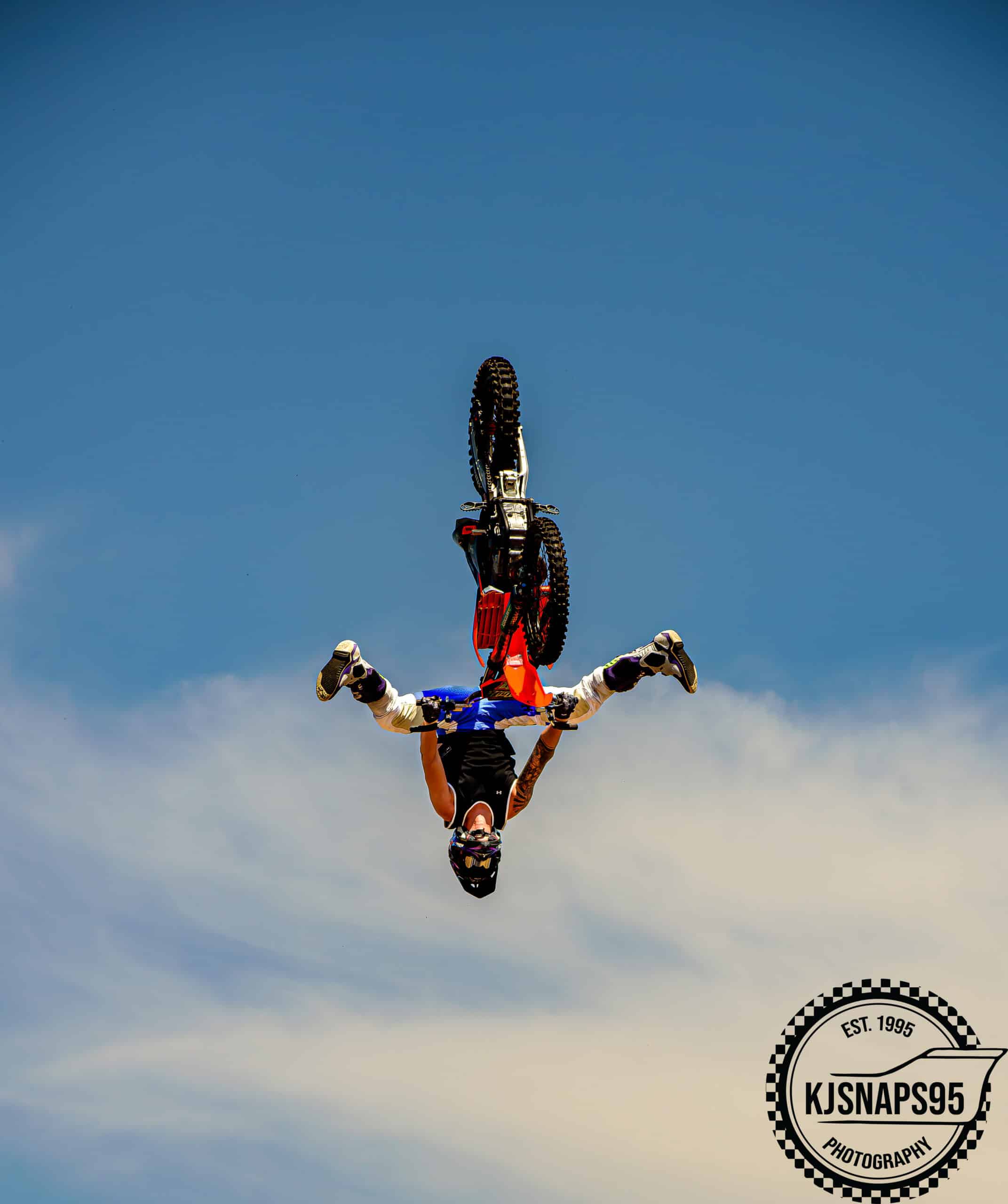 A photo shot by Kyrun of a stunt motorcyclist in the air, upside down